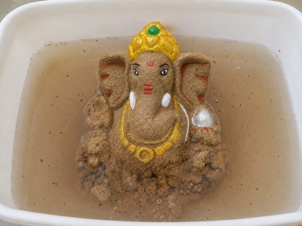 The idol softening and dissolving in water
